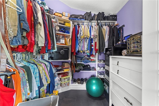 spacious closet featuring tile patterned flooring