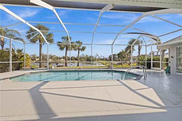 outdoor pool with a lanai and a patio area