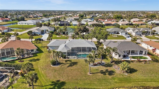 birds eye view of property with a residential view