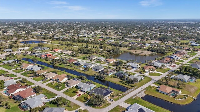 birds eye view of property featuring a residential view and a water view