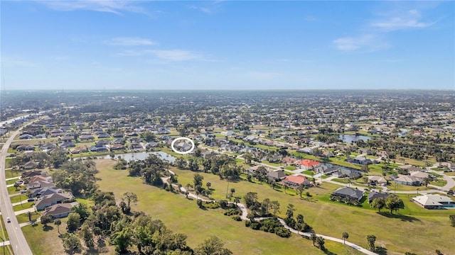 aerial view featuring a residential view and a water view