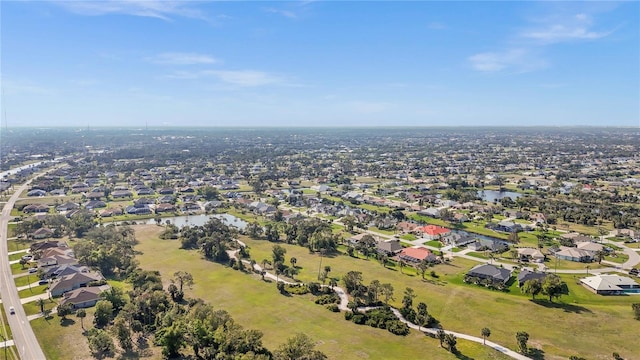 birds eye view of property with a residential view and a water view