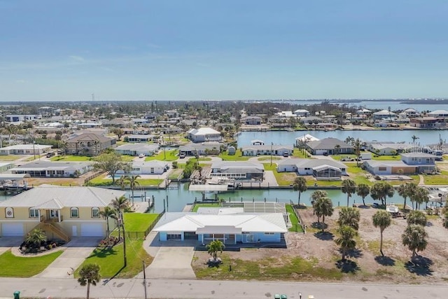 bird's eye view with a water view and a residential view