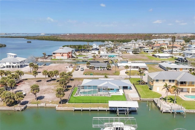 birds eye view of property featuring a residential view and a water view