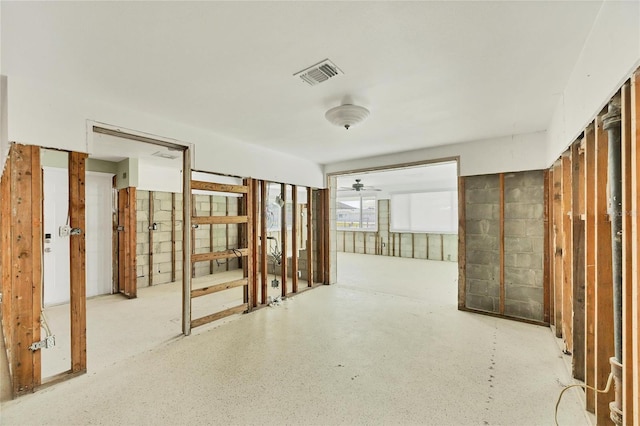 interior space featuring concrete block wall and visible vents