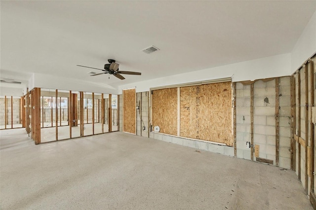 unfurnished room featuring visible vents and ceiling fan