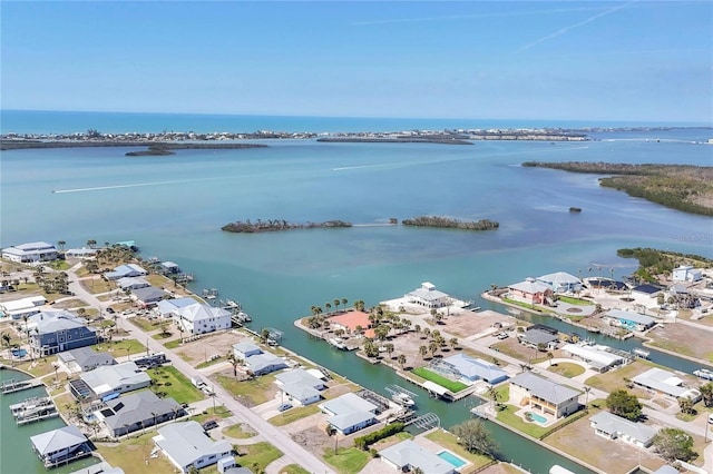 birds eye view of property with a water view and a residential view