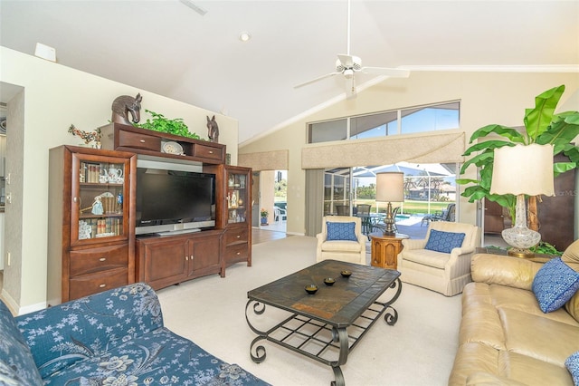 living area with vaulted ceiling, ceiling fan, a sunroom, and light colored carpet