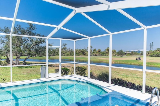 view of swimming pool featuring a pool with connected hot tub, glass enclosure, a water view, and a lawn