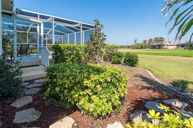 view of yard featuring a lanai