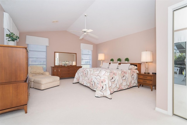 bedroom with lofted ceiling, ceiling fan, and carpet