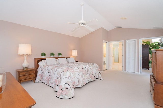 carpeted bedroom featuring a ceiling fan, lofted ceiling, visible vents, and connected bathroom