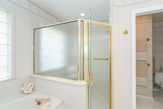 full bath featuring wallpapered walls, toilet, tile patterned floors, a garden tub, and a shower stall