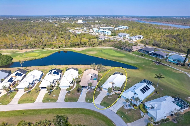 bird's eye view featuring view of golf course, a water view, a residential view, and a view of trees