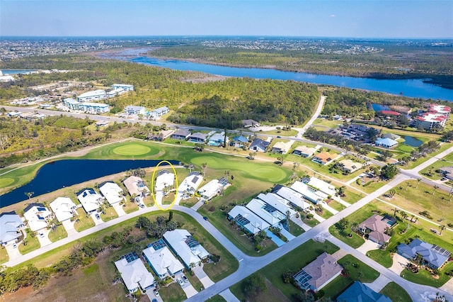 bird's eye view with a residential view, a water view, and golf course view