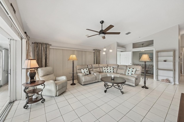 living area with light tile patterned floors, ceiling fan, vaulted ceiling, and visible vents