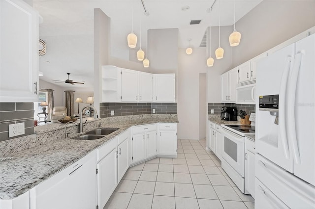 kitchen featuring white appliances, white cabinets, a sink, open shelves, and backsplash