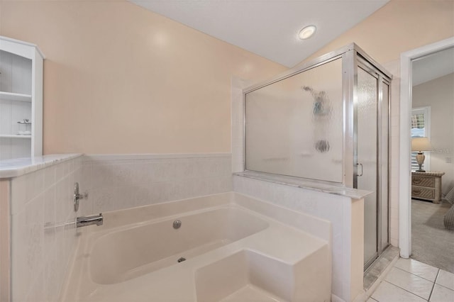 full bath with a garden tub, tile patterned flooring, a shower stall, and lofted ceiling