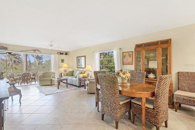 dining area with light tile patterned floors and ceiling fan