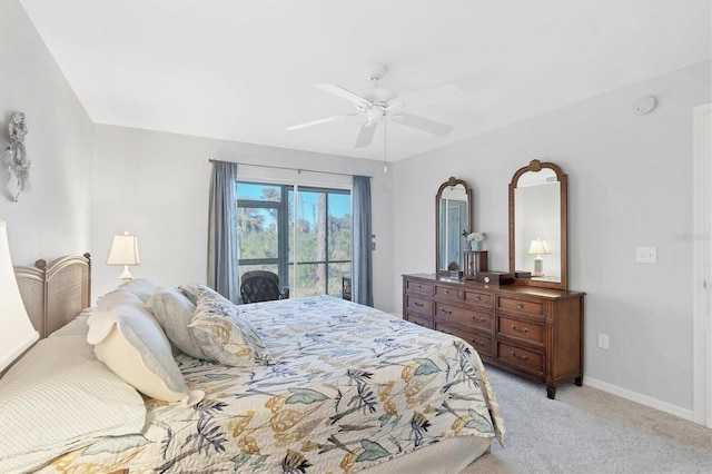 bedroom featuring ceiling fan, baseboards, and light carpet