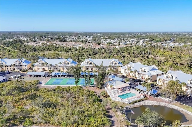 bird's eye view with a residential view and a water view