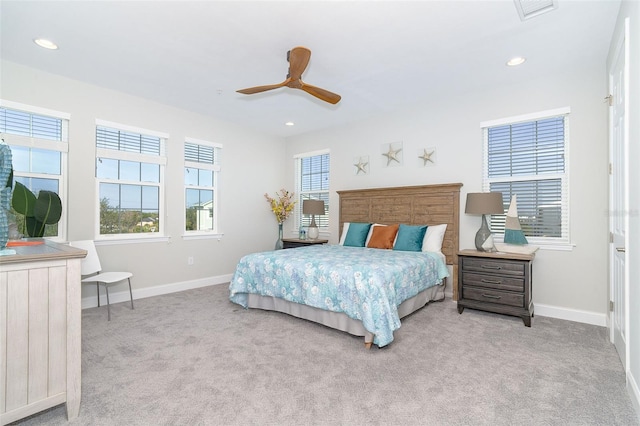 carpeted bedroom featuring recessed lighting, visible vents, and baseboards