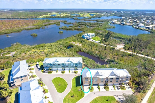 bird's eye view featuring a water view and a residential view