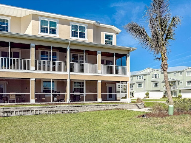 exterior space with a front yard and stucco siding