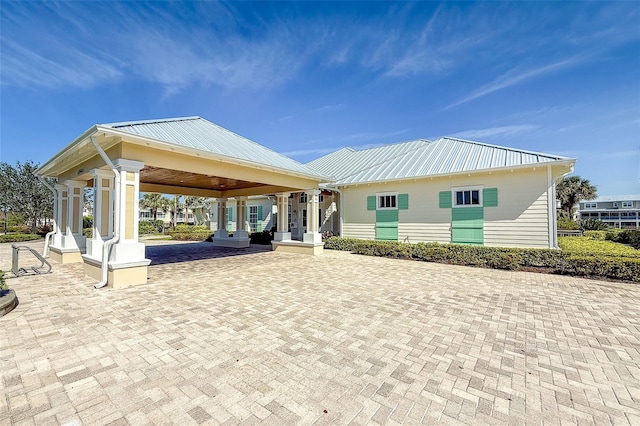 exterior space featuring metal roof and a gazebo