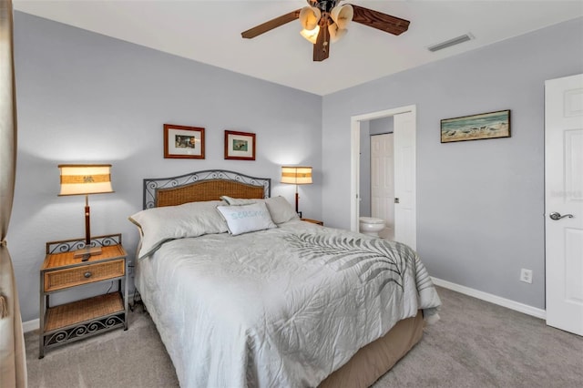 bedroom featuring baseboards, visible vents, connected bathroom, ceiling fan, and carpet flooring