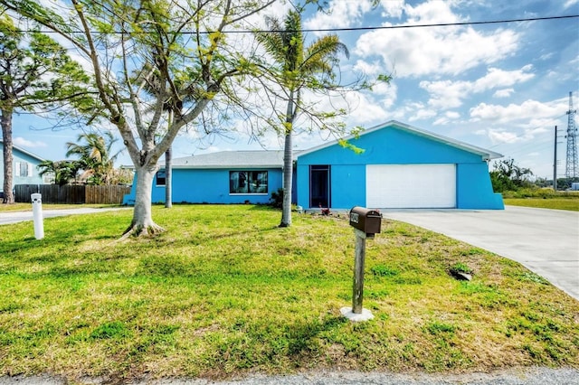 single story home featuring a garage, fence, concrete driveway, and a front yard