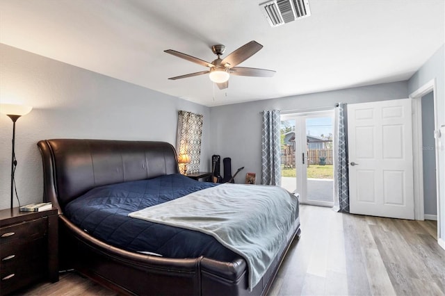 bedroom featuring ceiling fan, access to outside, light wood-type flooring, and visible vents