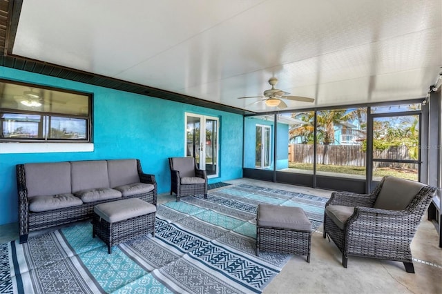 sunroom featuring ceiling fan