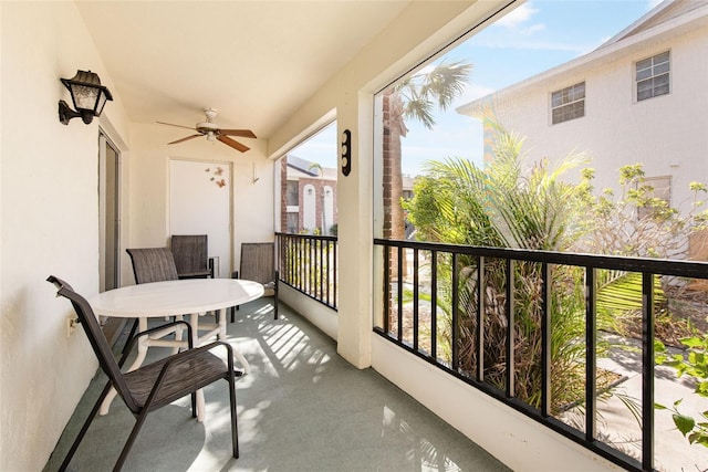 balcony featuring a ceiling fan