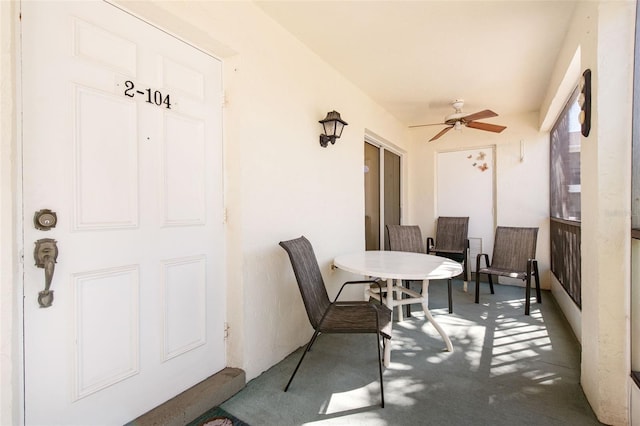 view of patio featuring a ceiling fan