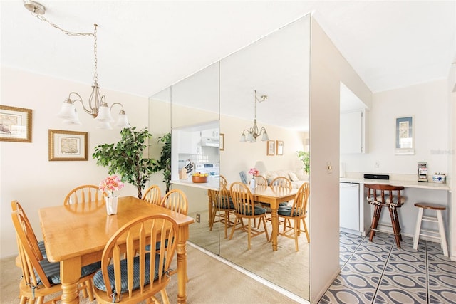 dining space with an inviting chandelier