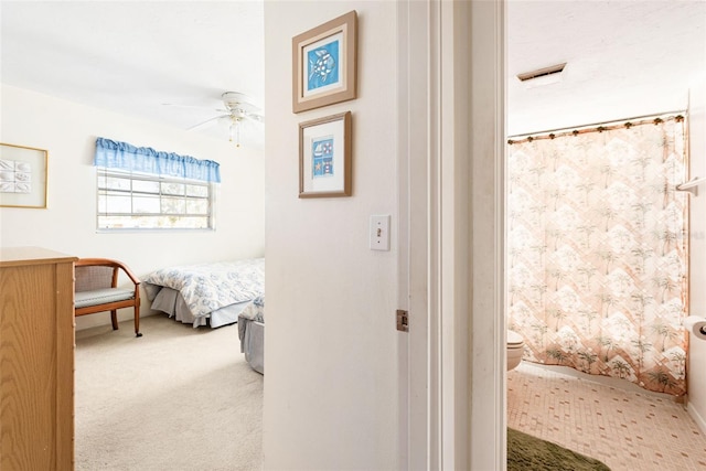 bedroom with carpet and a ceiling fan