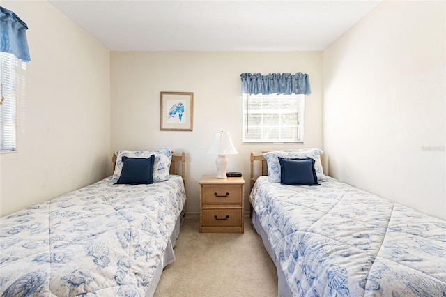 bedroom featuring light colored carpet