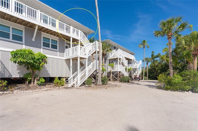 view of property featuring stairs