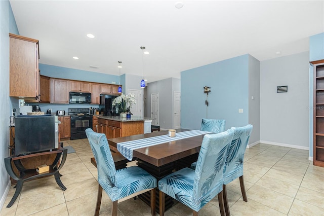 dining area with baseboards, light tile patterned flooring, and recessed lighting