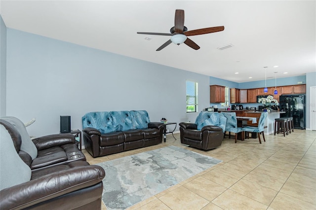 living area featuring recessed lighting, ceiling fan, visible vents, and light tile patterned flooring