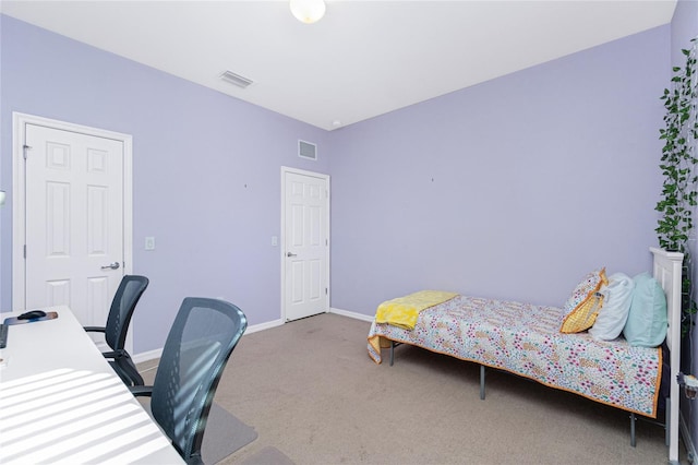 bedroom featuring carpet flooring, visible vents, and baseboards