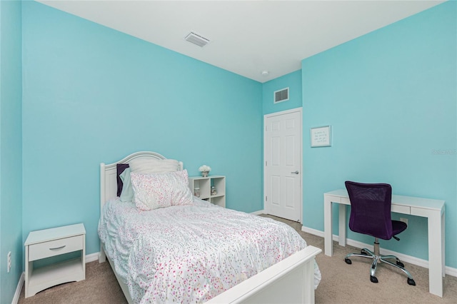 bedroom featuring carpet floors, visible vents, and baseboards