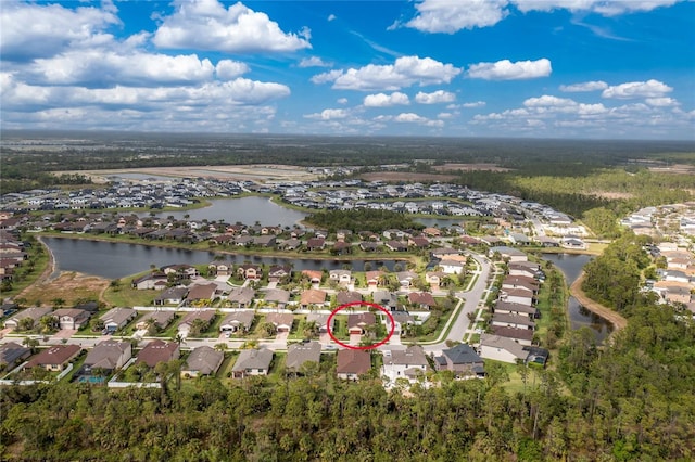 birds eye view of property with a residential view and a water view