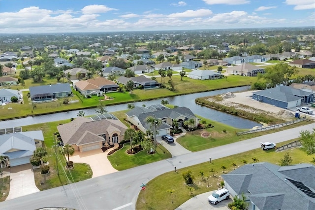 aerial view featuring a water view and a residential view