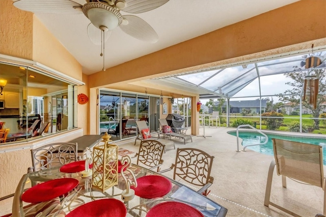 interior space featuring ceiling fan, a swimming pool, and vaulted ceiling