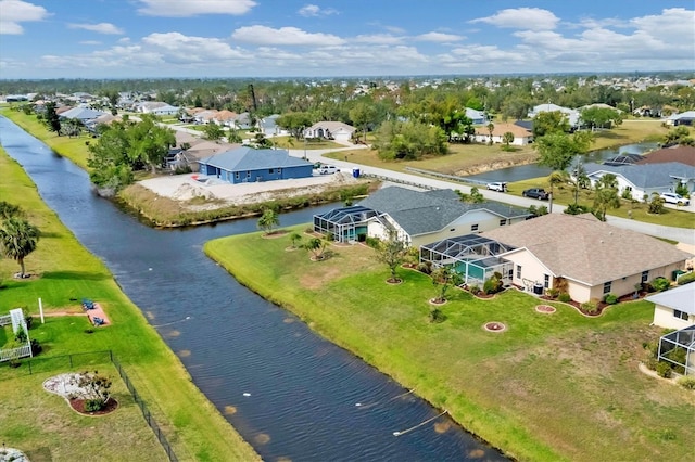 birds eye view of property featuring a water view and a residential view