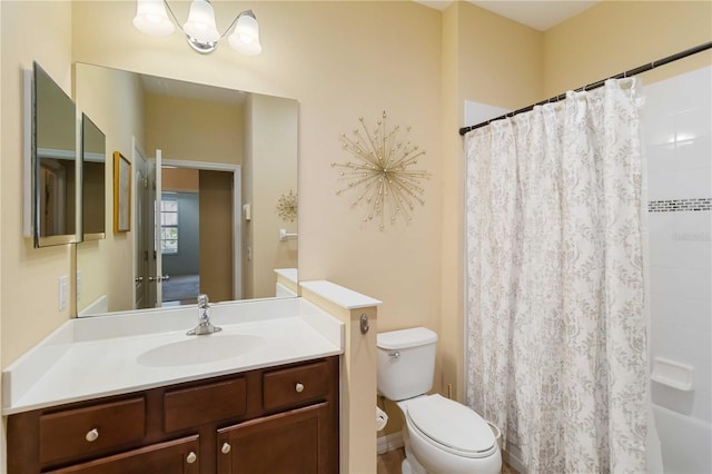 bathroom featuring toilet, a shower with curtain, and vanity