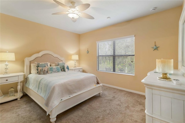 bedroom featuring a ceiling fan, carpet, and baseboards