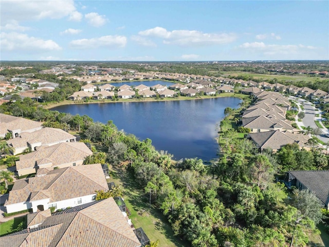 bird's eye view featuring a water view and a residential view